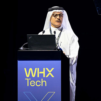 Dr Ameer Al Ameeri addressing the audience on World X stage at WHX Tech 2025