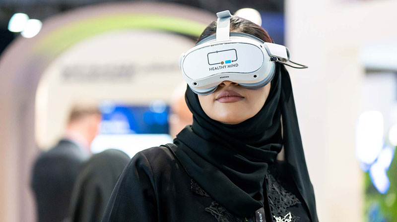 Female attending WHX Tech 2025 trialing Healthy Mind VR