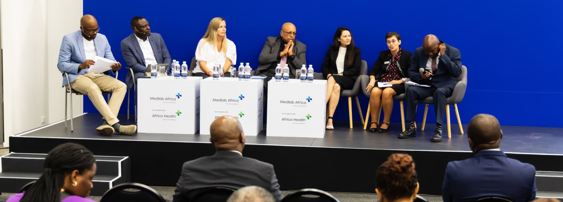 Speakers on stage at World Health Expo Labs Cape Town.