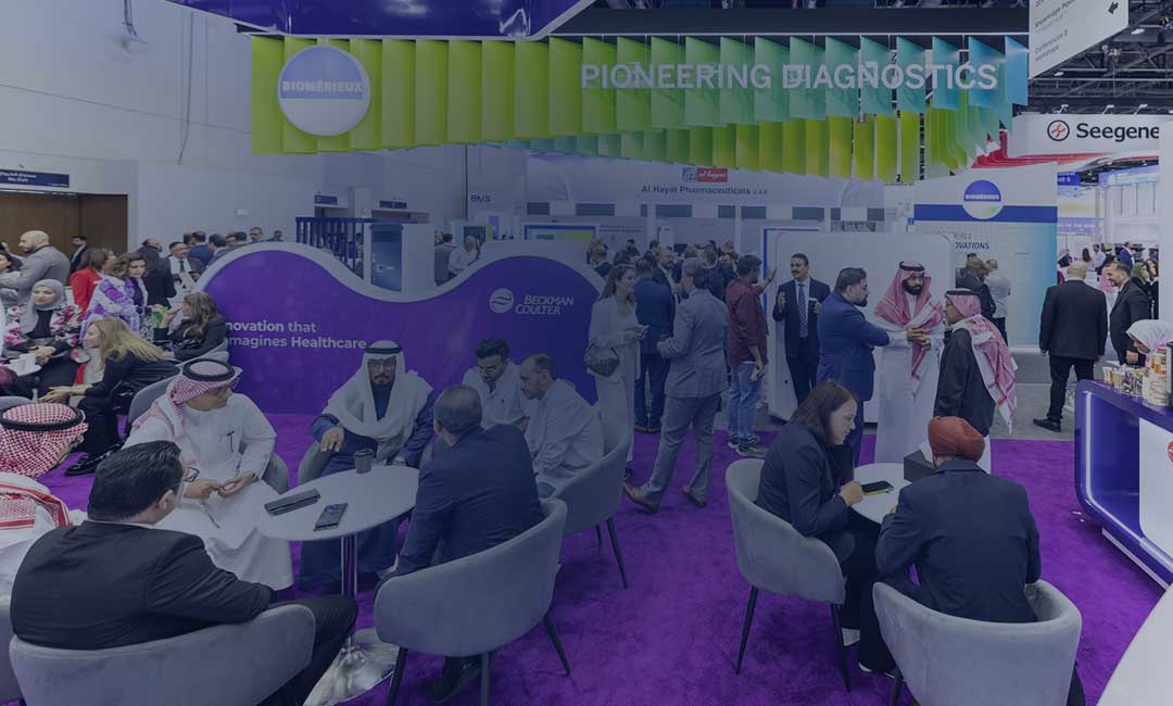 WHX Dubai on signboard with attendees walking by