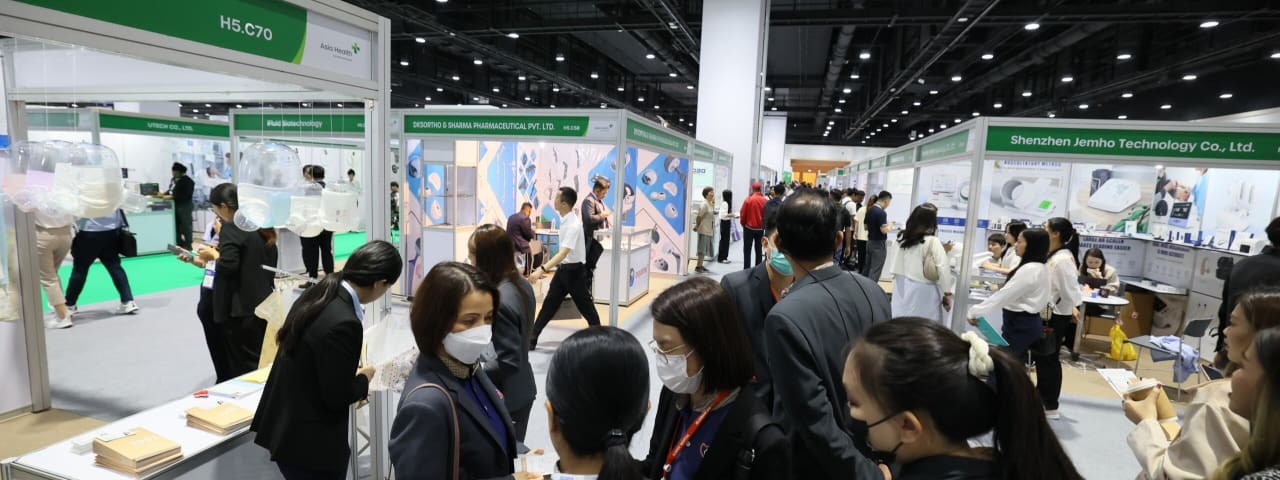 Exhibitors talking with potential customers at World Health Expo Kuala Lumpur