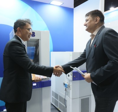 Delegates shaking hands at World Health Expo Labs Kuala Lumpur